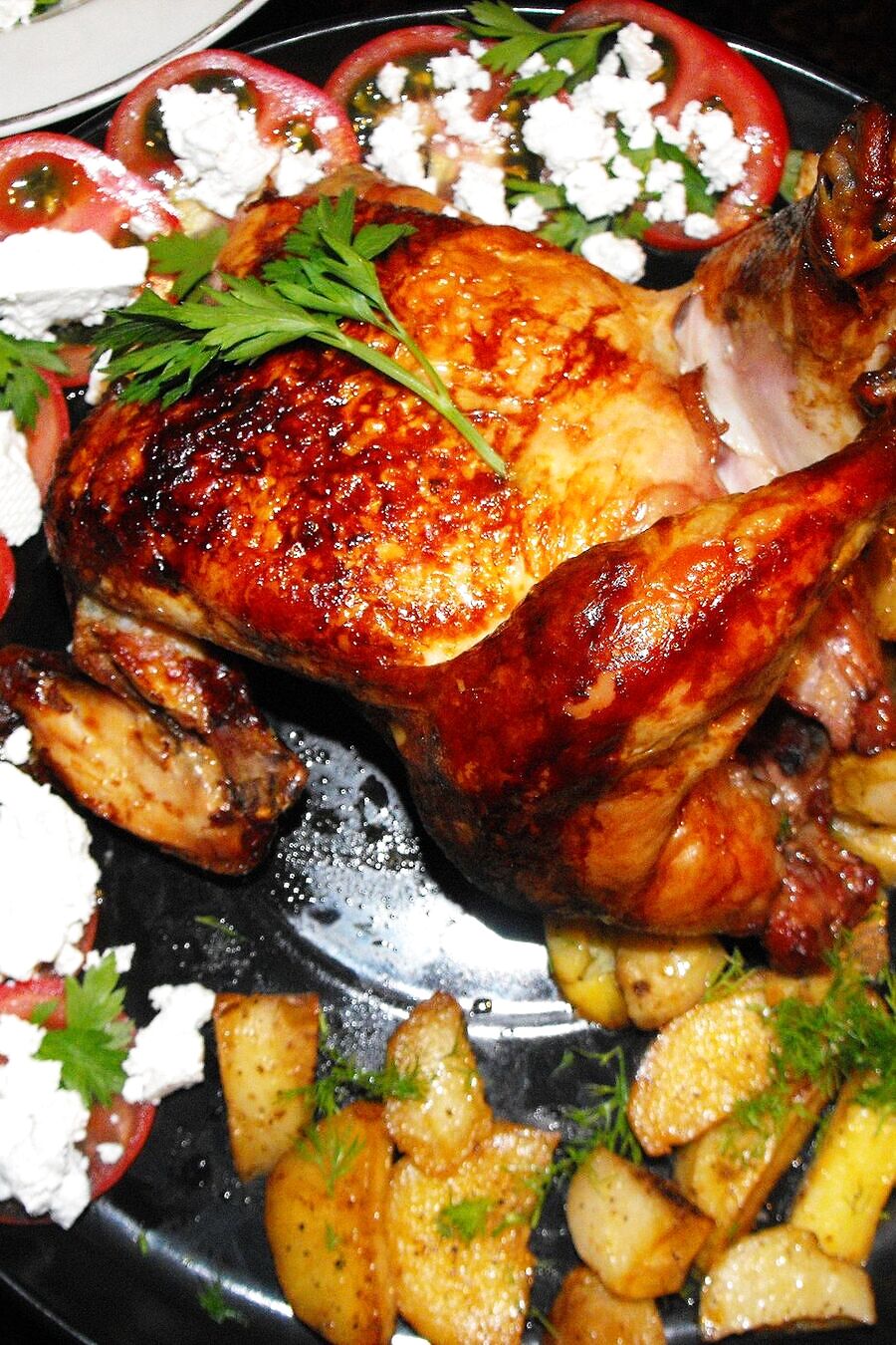 Orata al forno con patate e pomodori